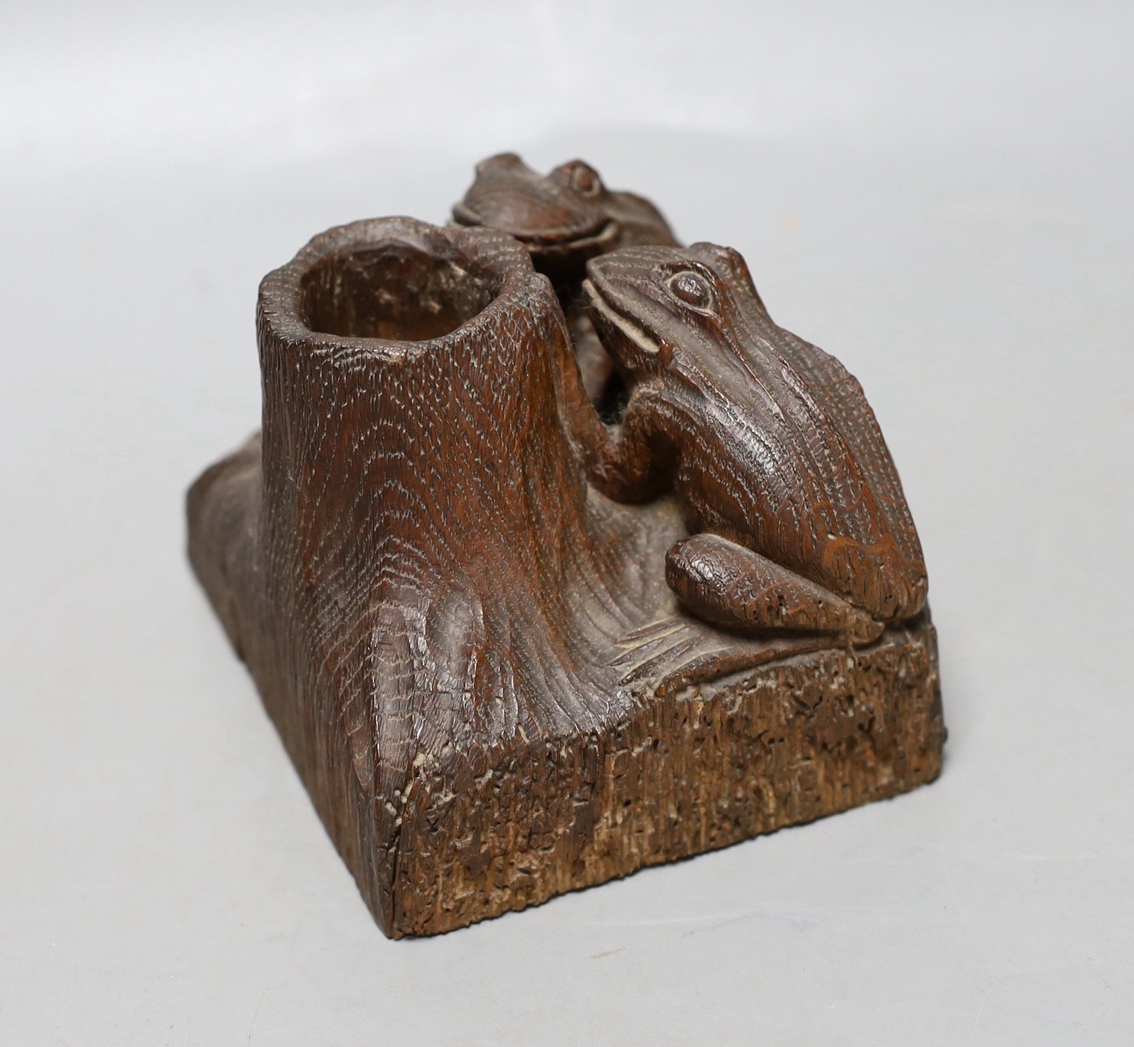 A carved oak ‘frog’ spill vase or inkwell holder, 10cm tall